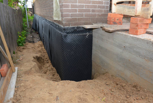 SJ Waterproofing Pros technician performing targeted Foundation Crack Repair assessment in Flat Rock, MI